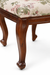 Angled view of Louis Dining Chair No.5 with a cane back, floral upholstered seat and walnut-finished frame.