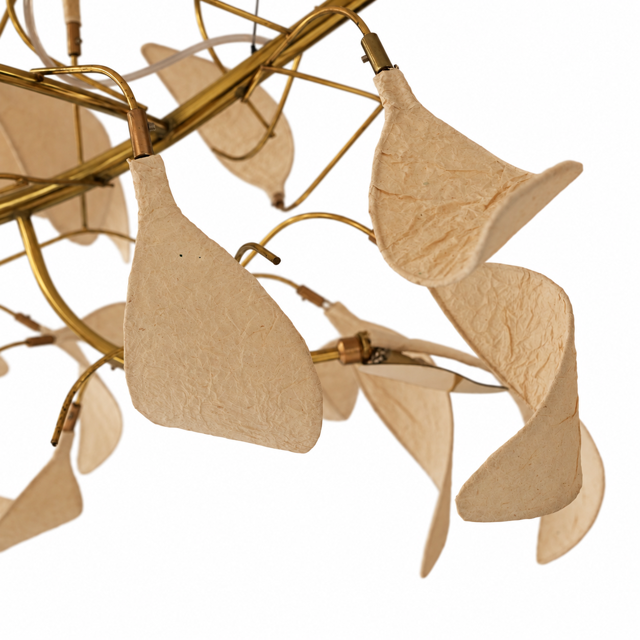 Close-up of Arbor Chandelier, showing textured paper leaves and brass branches.