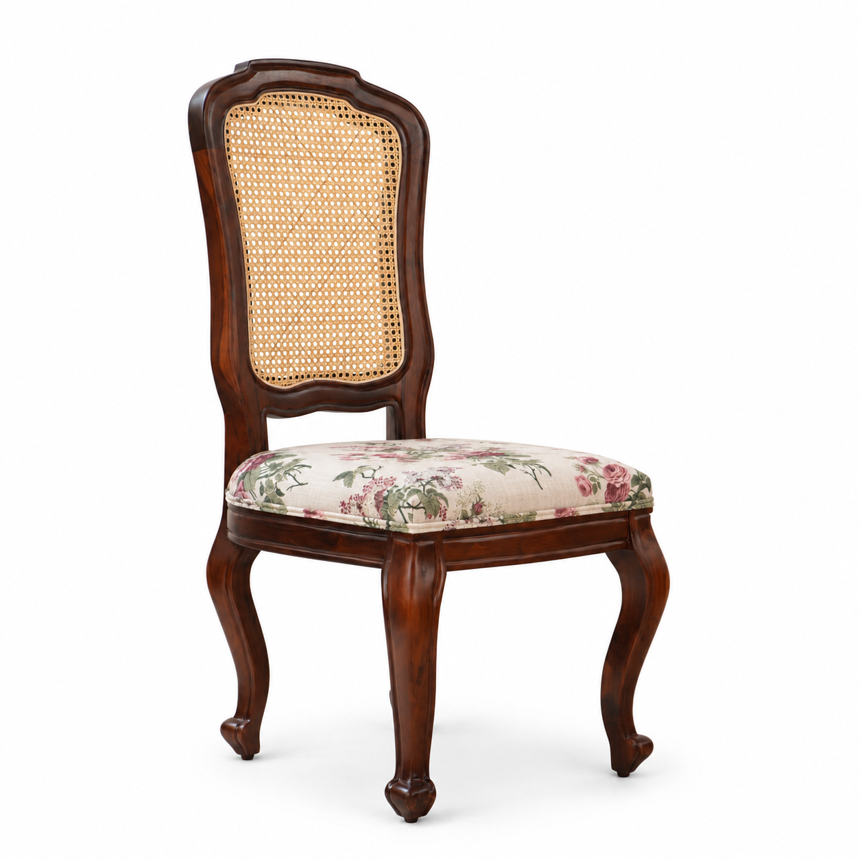 Three-quarter view of Louis Dining Chair No.5 with a cane back panel, walnut-finished mango wood frame and floral upholstered seat.