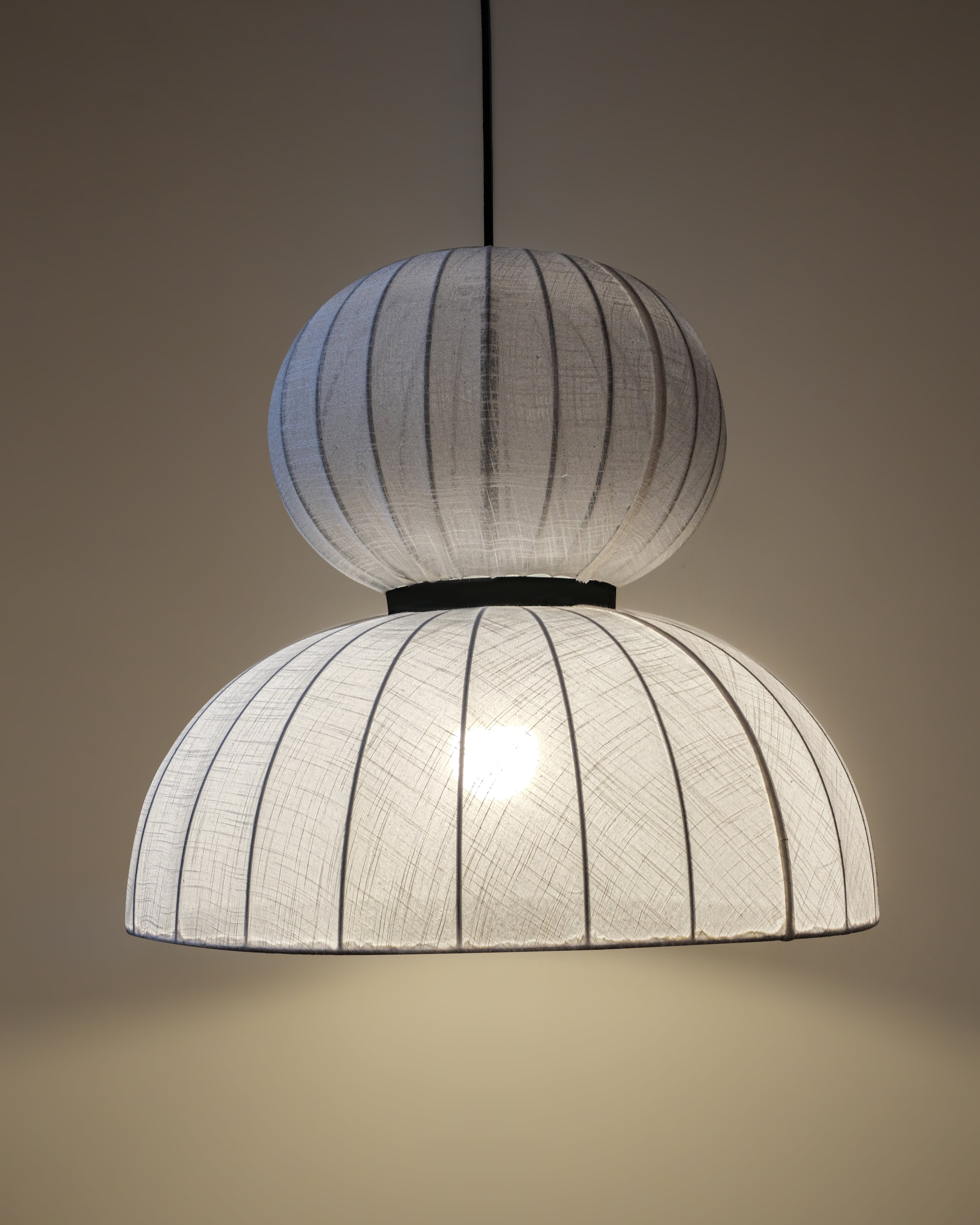 White fabric lampshade crafted from premium cotton linen, enhancing interior aesthetics.