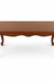 Louis Dining Table No.5 viewed at an angle, showing its rectangular top, curved apron and shaped legs.