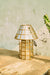 Brass-Aged Table Lamp on a wooden surface