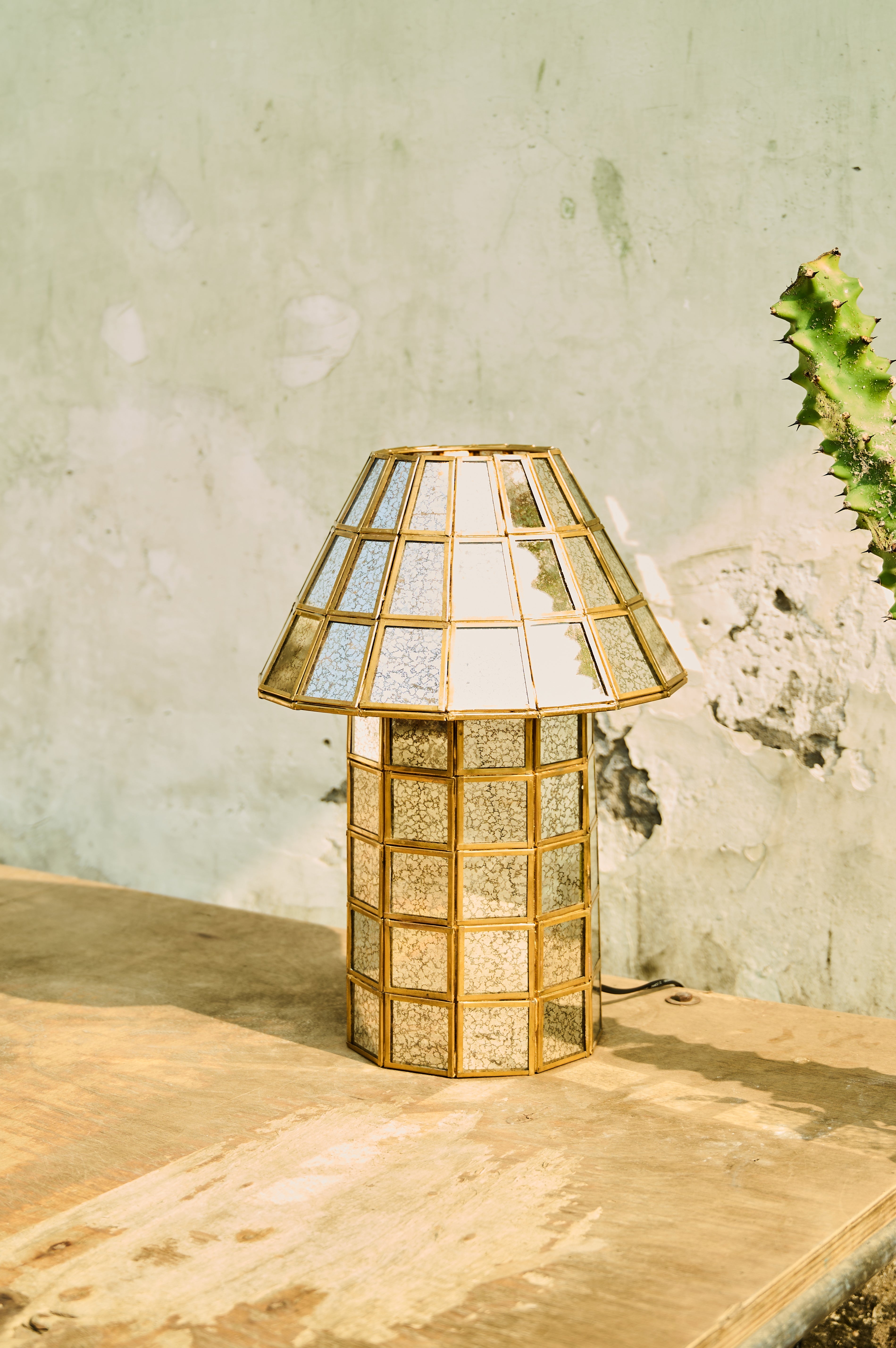 Brass-Aged Table Lamp on a wooden surface
