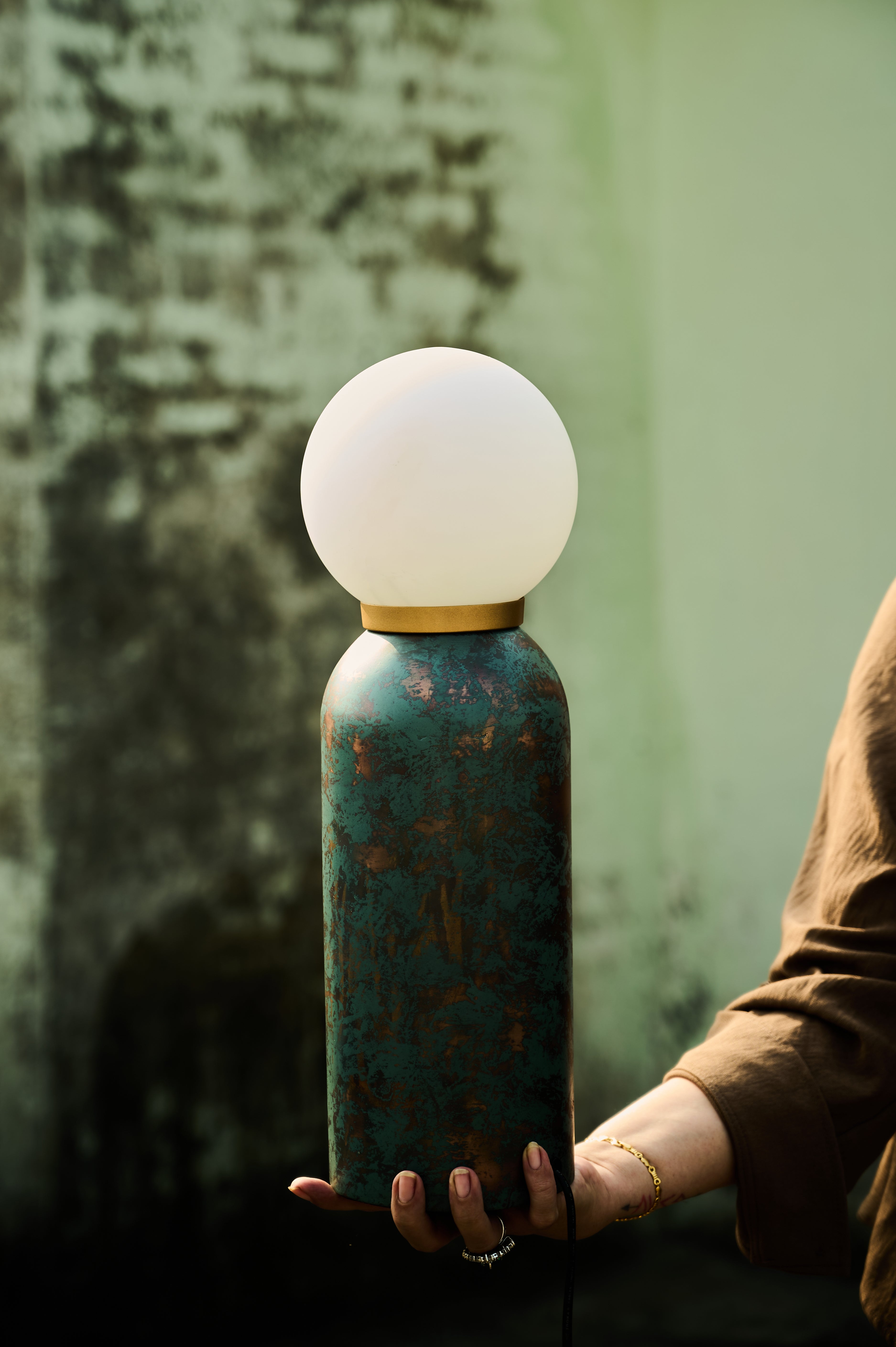 Moon Table Lamp held in a hand