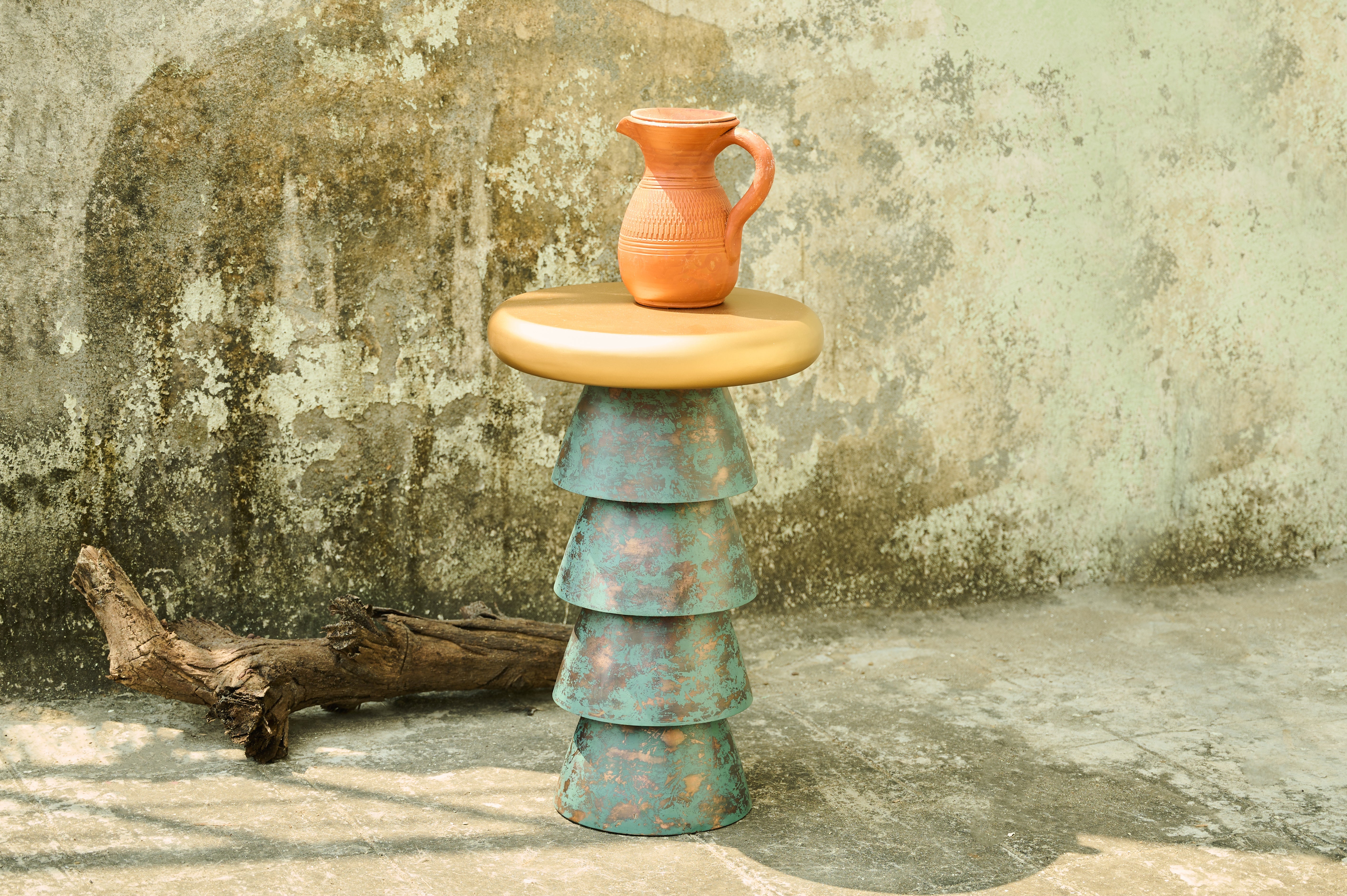 Bucket Drink Table wide view beside a textured wall