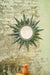Corona Mirror above a side table with a jug
