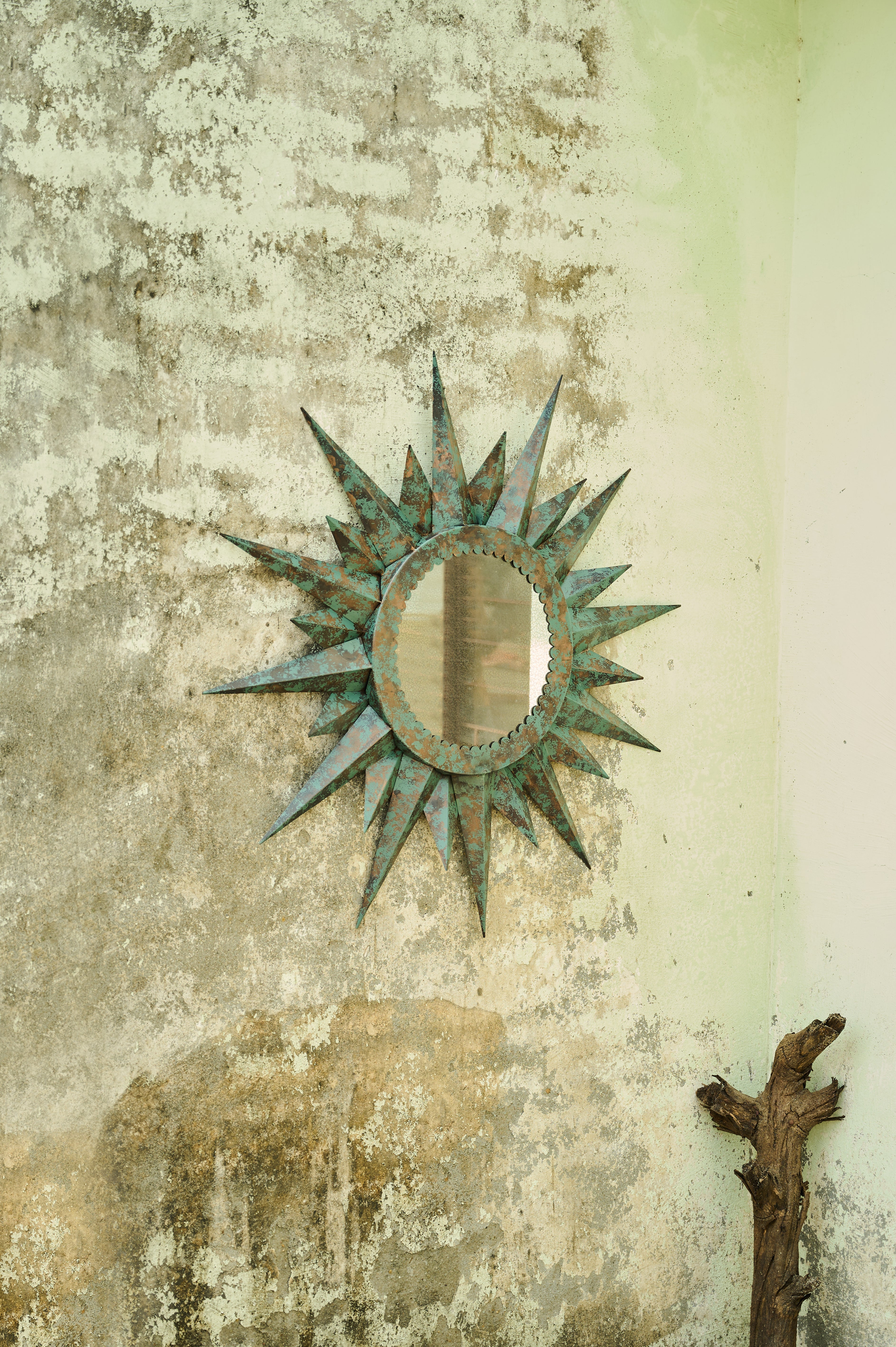 Corona Mirror angled view on a textured wall