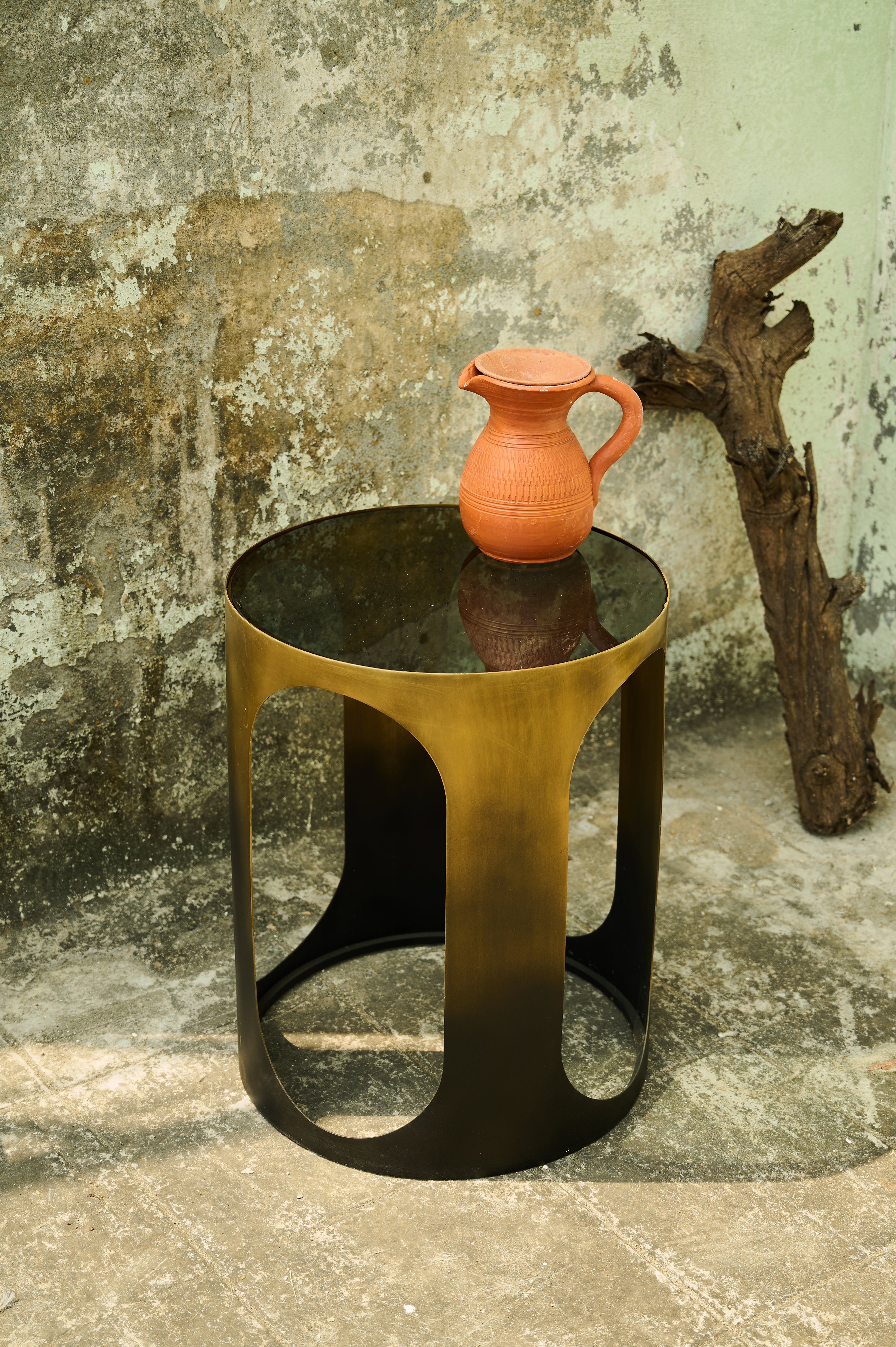 Oval Side Table with a jug on its top