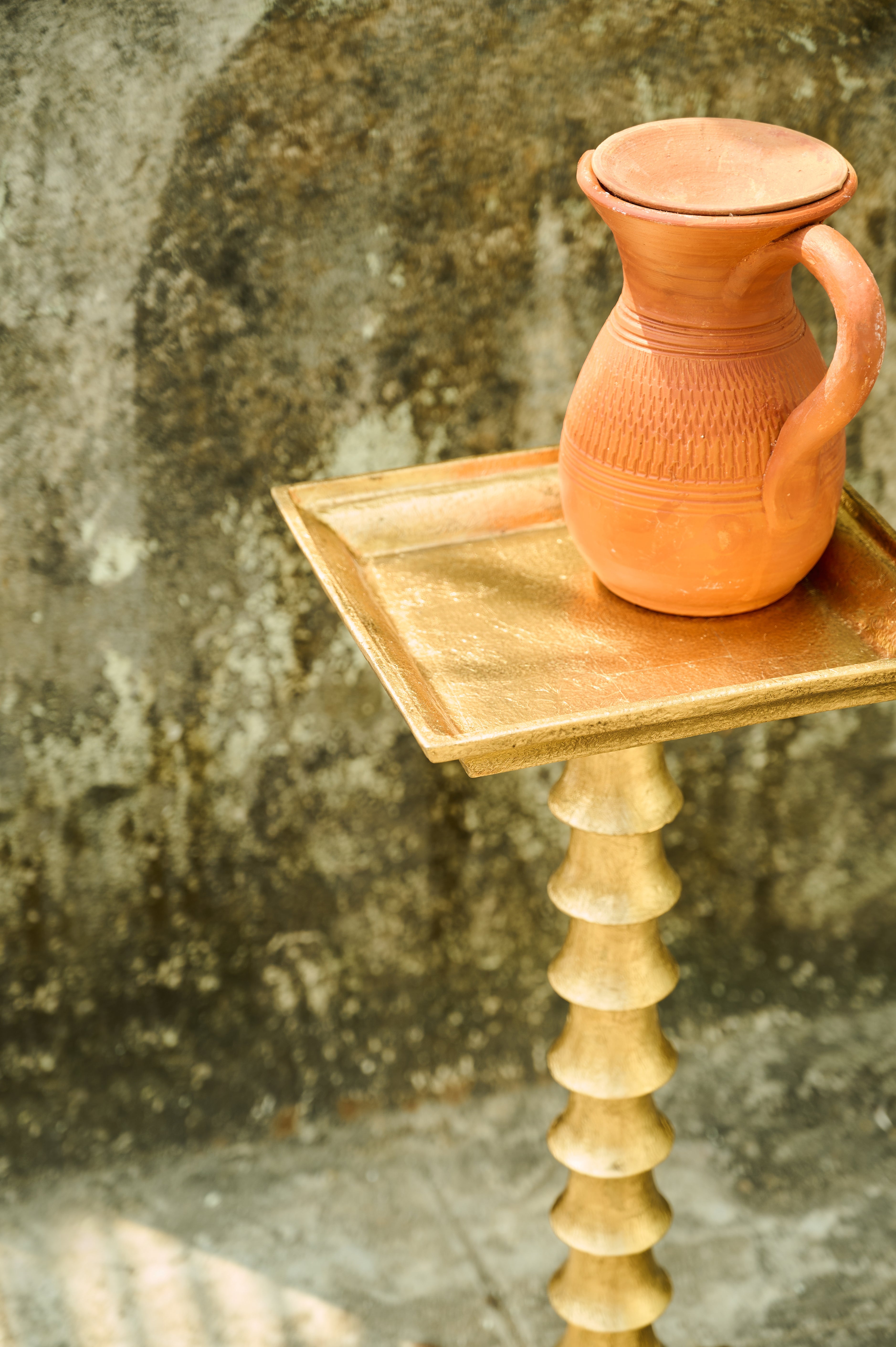 Trunk Drink Table angled top detail with a jug