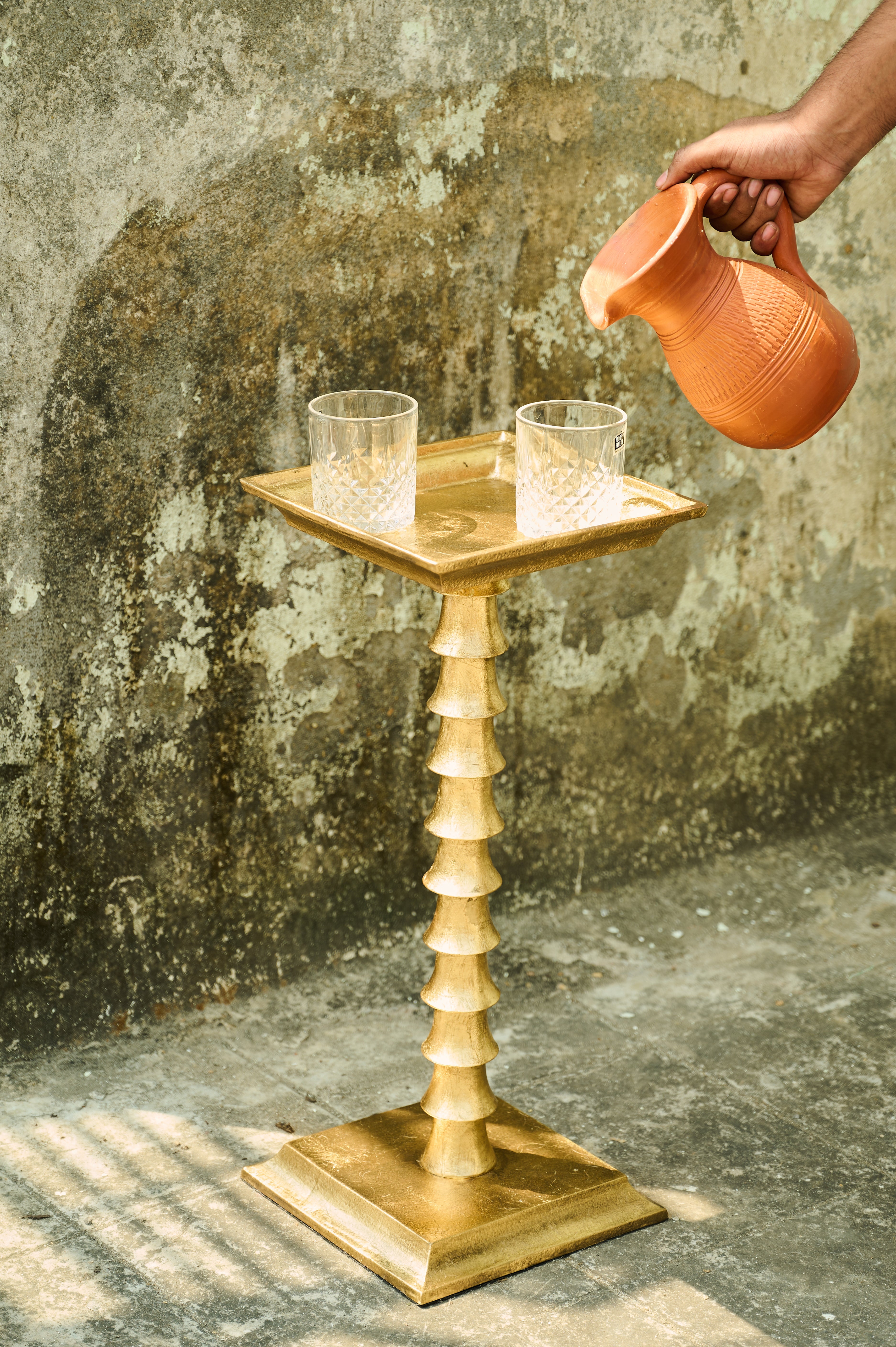 Trunk Drink Table with glasses as a jug pours