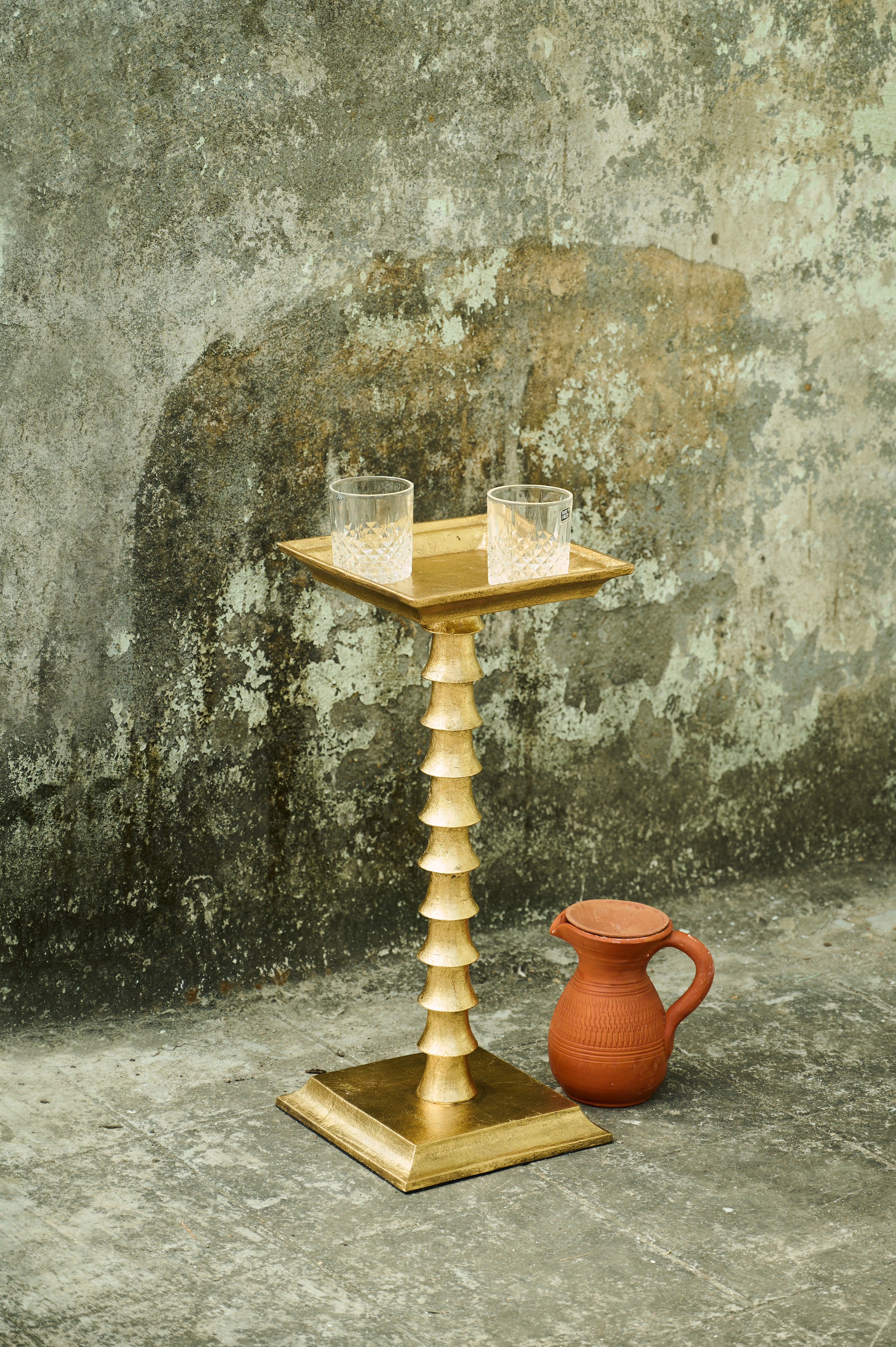 Trunk Drink Table with glasses on top and jug below
