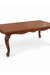 Angled view of Louis Dining Table No.5 with a rectangular walnut-finished top and shaped legs.