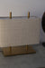 Embrace modern minimalism with our fabric and metal table lamp