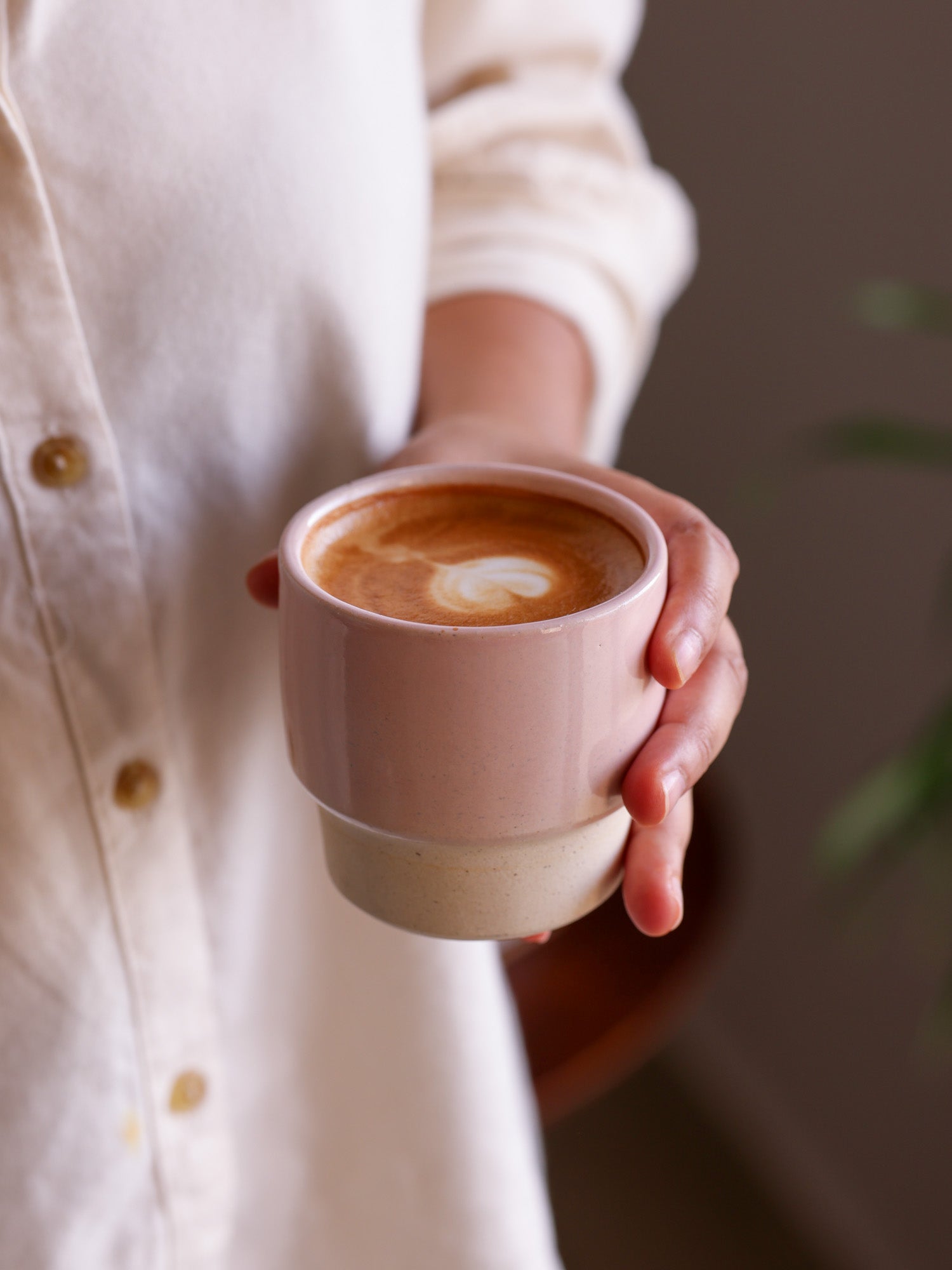 Blush pink stackable cup with coffee