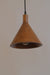 Brown pendant light hanging against a plain wall
