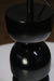 Designer table lamp with a unique stacked black base and contrasting white shade, perfect for interiors.