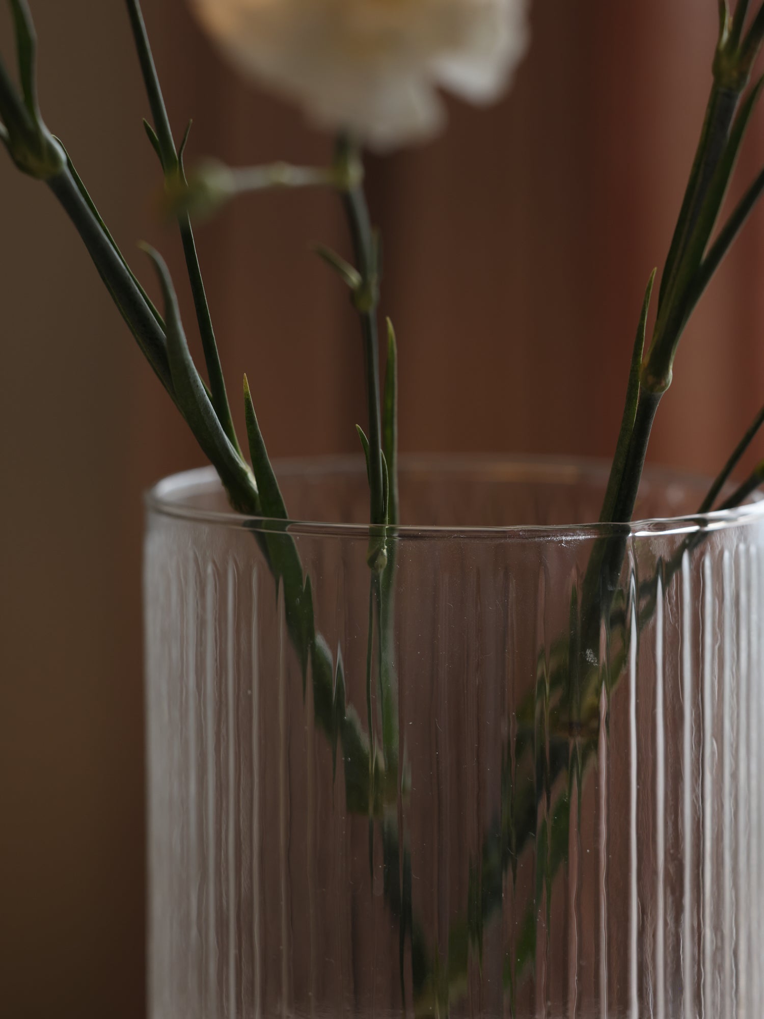 Fluted glass vase with gold plate.