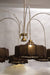 Luxurious modern chandelier featuring multiple tiers of warm glowing lights, suspended in a grand entryway.