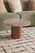 premium marble and wood coffee table in front of a green sofa on a patterned rug