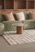 Marble round coffee table in a modern living room setting.