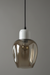 Smoked glass pendant light with white base on a gray background
