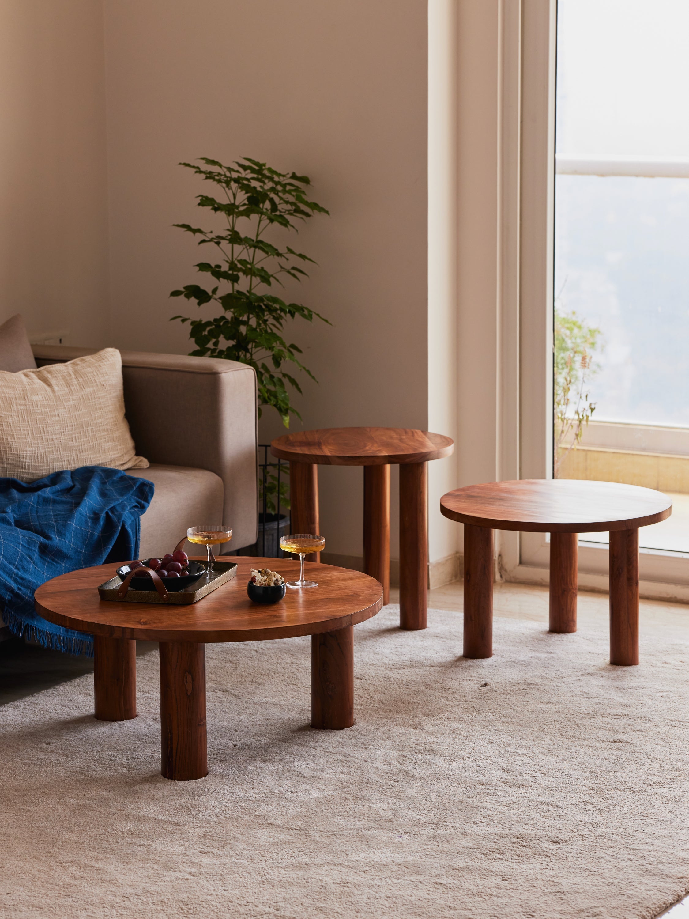 Solid wood round tables by Fleck