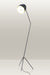 Stylish floor lamp with a tripod base and an adjustable head for directed illumination.