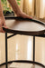 Modern round side table with lift-off wood tray and storage shelf.