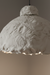 Textured pendant light fixture on a neutral background