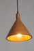 Wooden pendant light with a warm glow on a gray background