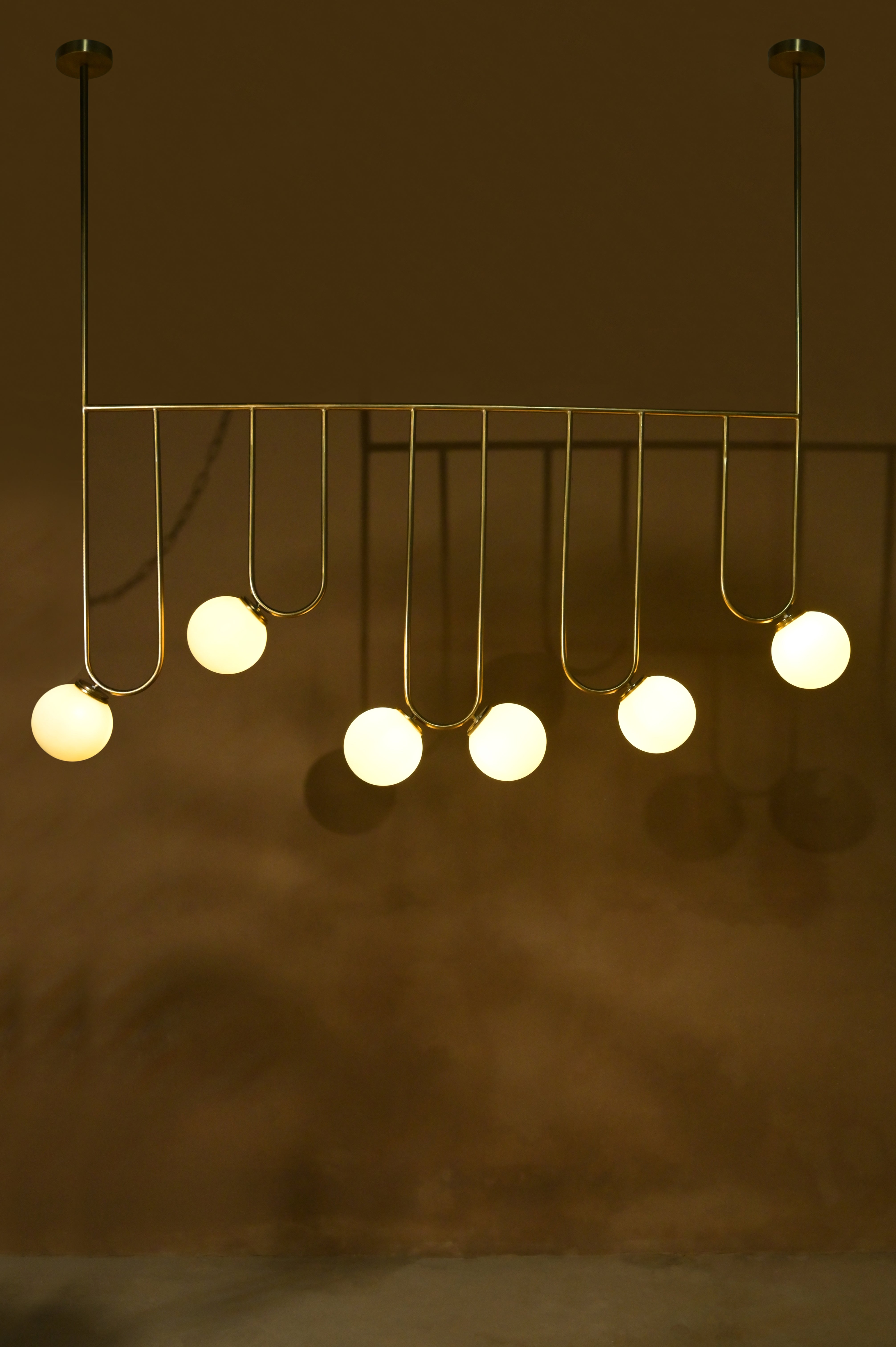 Aure Chandelier - L:55 x W:6 x H:49 In inches / Metal - Lighting