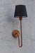 Stylish wall-mounted lamp with a black lampshade and luxurious copper metal arm, adding a touch of sophistication.