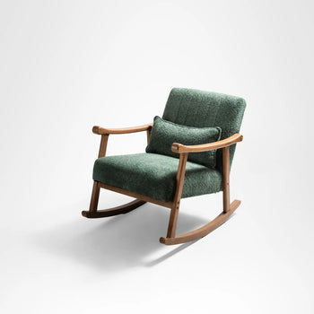 A cozy emerald green upholstered rocking chair with light wood arms and legs.