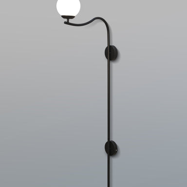 Modern Glamour Arch Wall Lamp with a gracefully curved black arm and warm, ambient lighting from a white shade