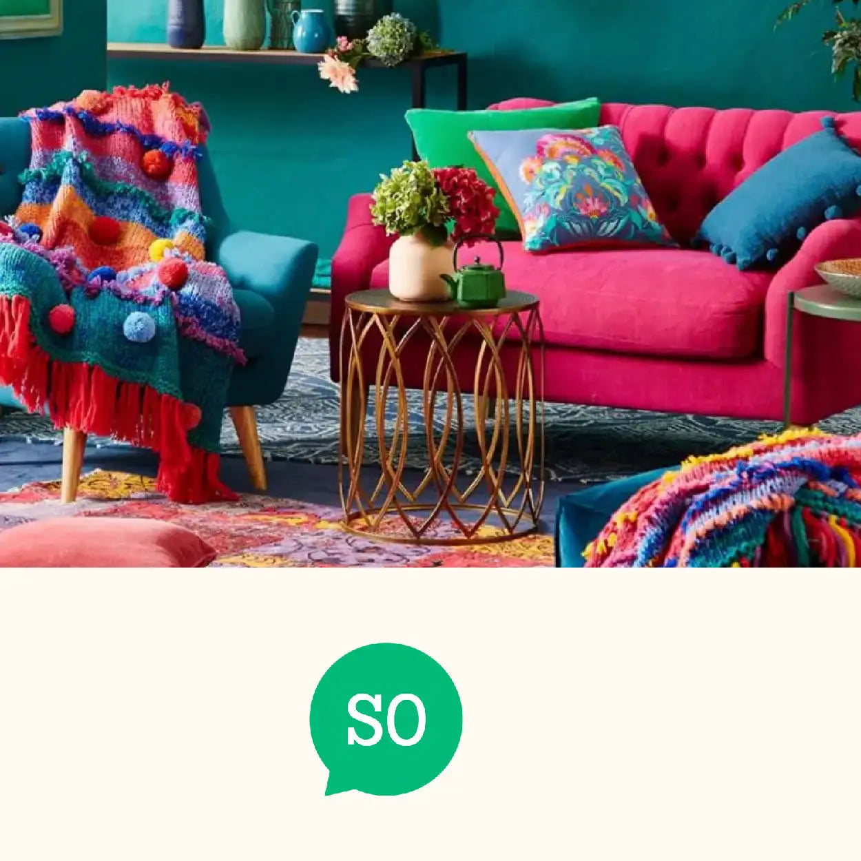 Vibrant pink tufted sofa with green and blue throw pillows