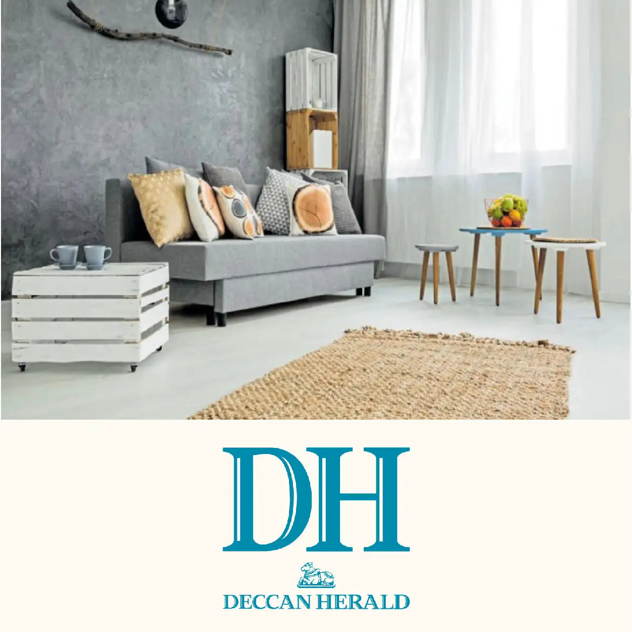 Gray upholstered sofa with multiple patterned throw pillows and a modern, minimalist design.
