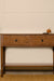 Manila Console Table - Brown / Frame: Teak veneer, plywood; Drawer Front Carved Panel, Legs: Teakwood; Storage lined