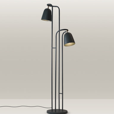 Sleek black floor lamp with two adjustable heads, perfect for modern luxury homes.