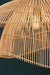 Wicker pendant light with a dark background