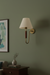 Wooden wall light designed for resort-style interiors.