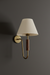 Wall-mounted wooden light creating soft, calming illumination for resort and hospitality spaces.