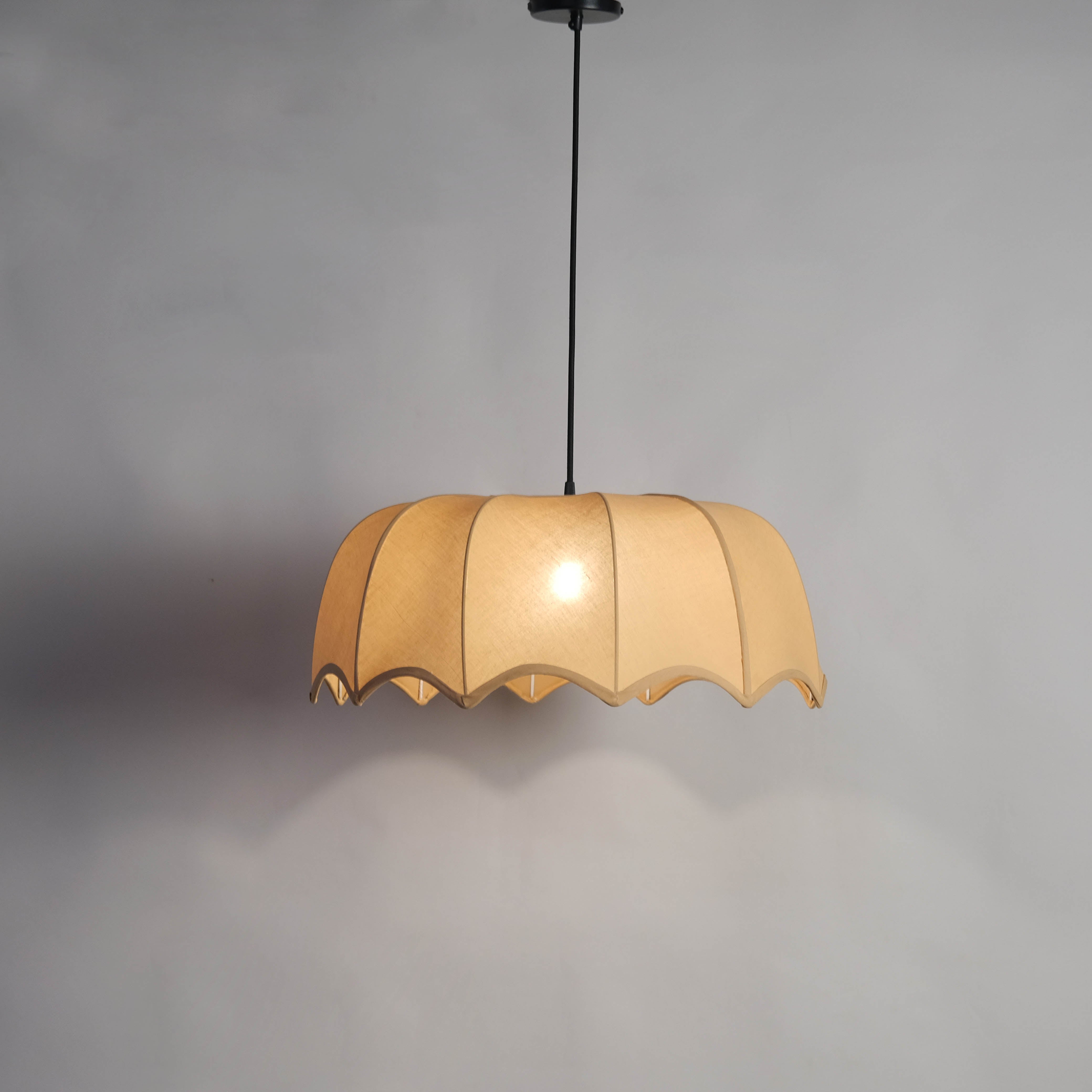 Adjustable cord fabric pendant light with a beige shade, ideal for versatile interior d√©cor needs