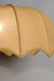 Close-up of a beige fabric pendant light with a unique wavy design, blending modern and classic styles