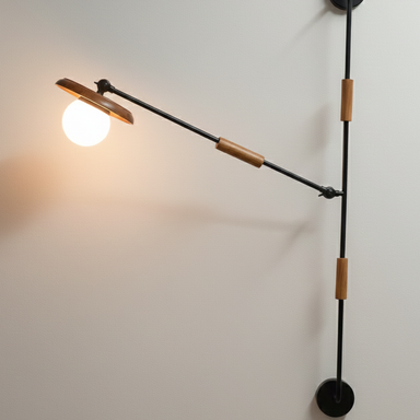 Modern wall-mounted light fixture with adjustable arm on a white wall