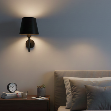 Modern bedroom with a bedside table and wall lamp.