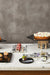 The Riser - Gold & Black / Brushed Brass Base, Toughened Glass Top / 8in X 8in X 4in - Decor