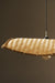 Thin wavy bamboo hanging lampshade handcrafted with elegant curved weaving, offering a warm ambient glow and a modern eco-friendly décor aesthetic.